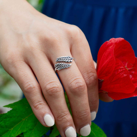 Luxe Silver Plate Adjustable Sprig Leaf Ring  on hand holding flower