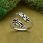 Luxe Silver Plate Adjustable Sprig Leaf Ring  on green background