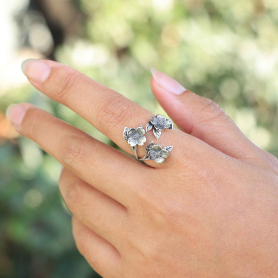 Luxe Silver Plate Adjustable Dogwood Flowers Ring on hand