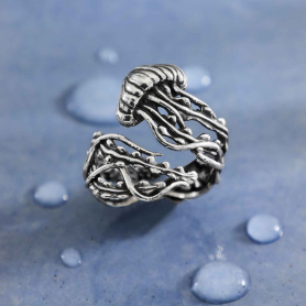 Luxe Silver Plate Adjustable Jellyfish Ring on blue background
