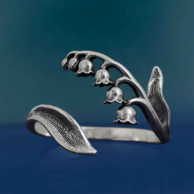 Luxe Silver Plate Adjustable Lily of the Valley Ring on blue background