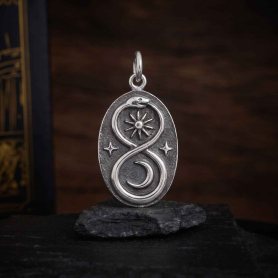 Luxe Silver Plate Infinity Snake Pendant with Moon on dark backround