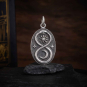 Luxe Silver Plate Infinity Snake Pendant with Moon on dark backround