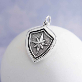 Luxe Silver Plate North Star Shield Wax Seal Charm on light blue and white background