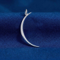 Luxe Silver Plate Skinny Crescent Moon Pendant on dark blue background