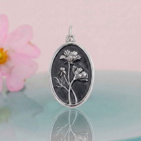 Luxe Silver Plate Cosmo Charm on pink background