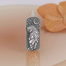 Luxe Silver Plate Barn Owl and Moon Pendant on orange background