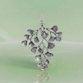 Luxe Silver Plate Maidenhair Fern Charm on green background