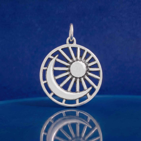 Luxe Silver Plate Moon and Sun Pendant on blue background