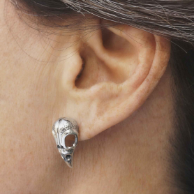 Luxe Silver Plate Raven Skull Post Earrings on ear