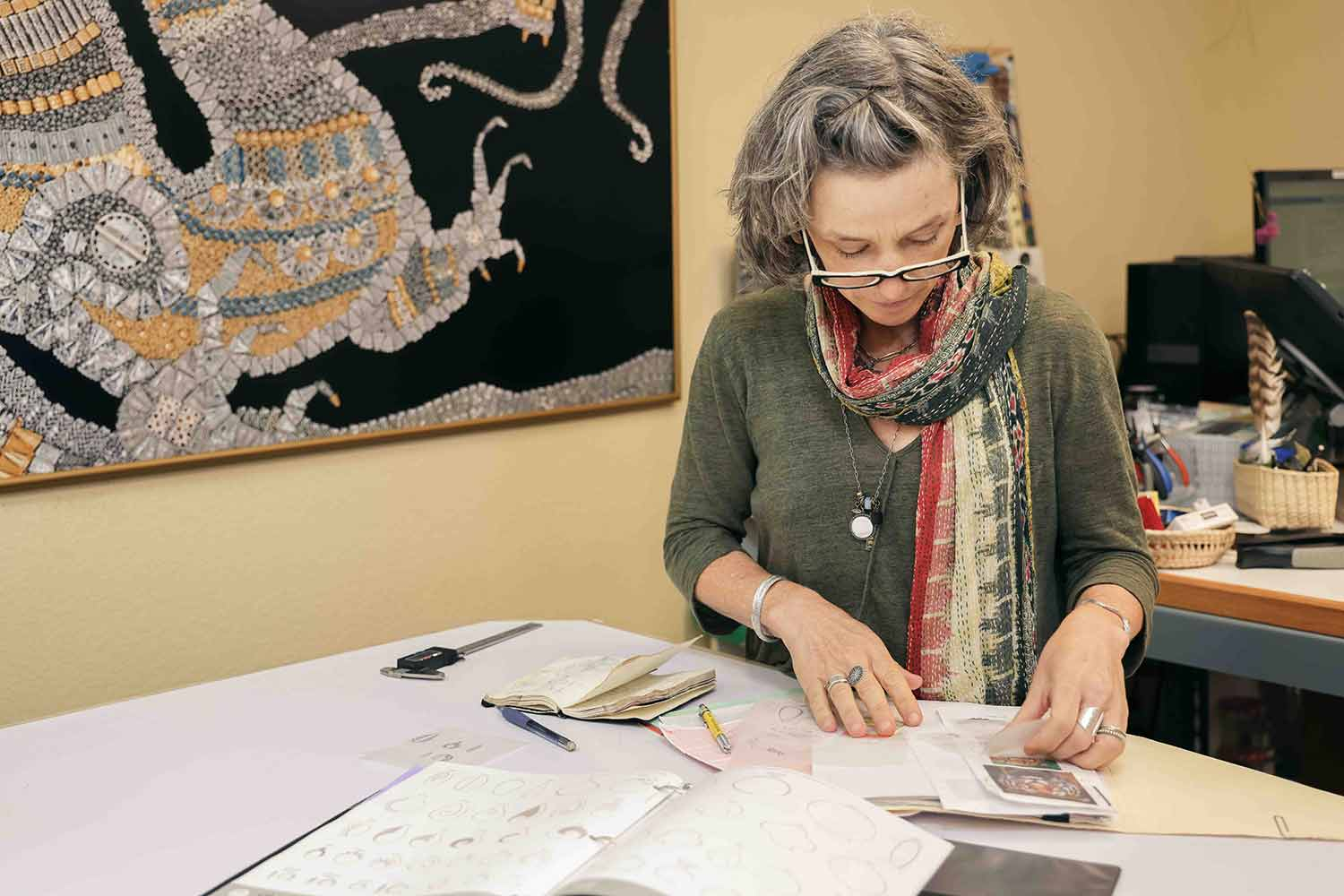 Leah Reviewing Sketches of charms