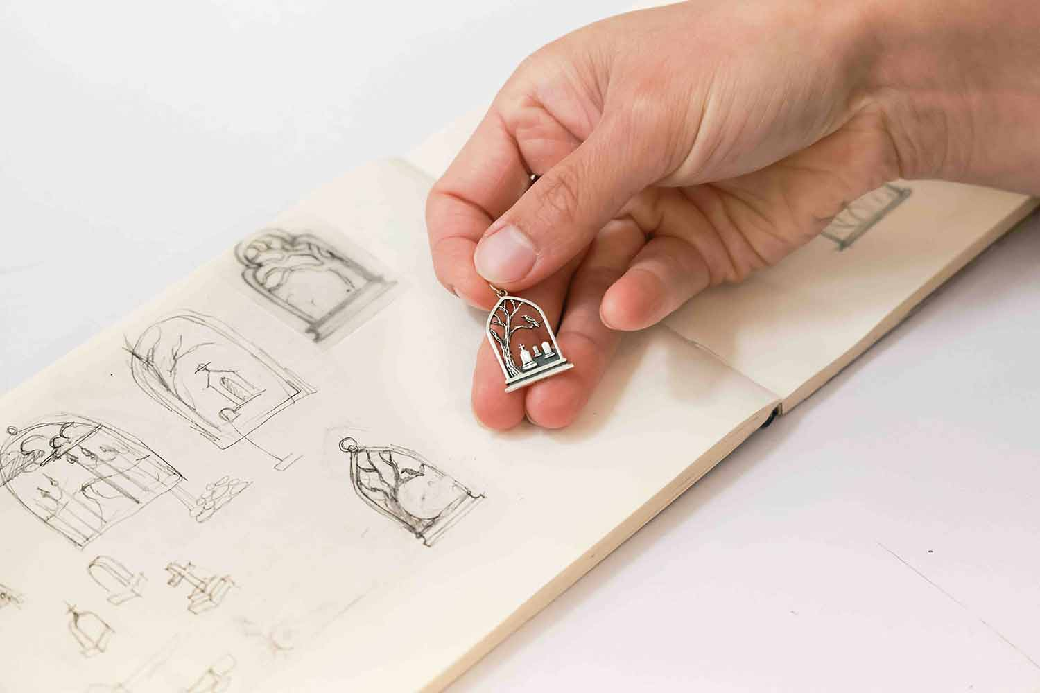 Graveyard Charm shown with original sketch
