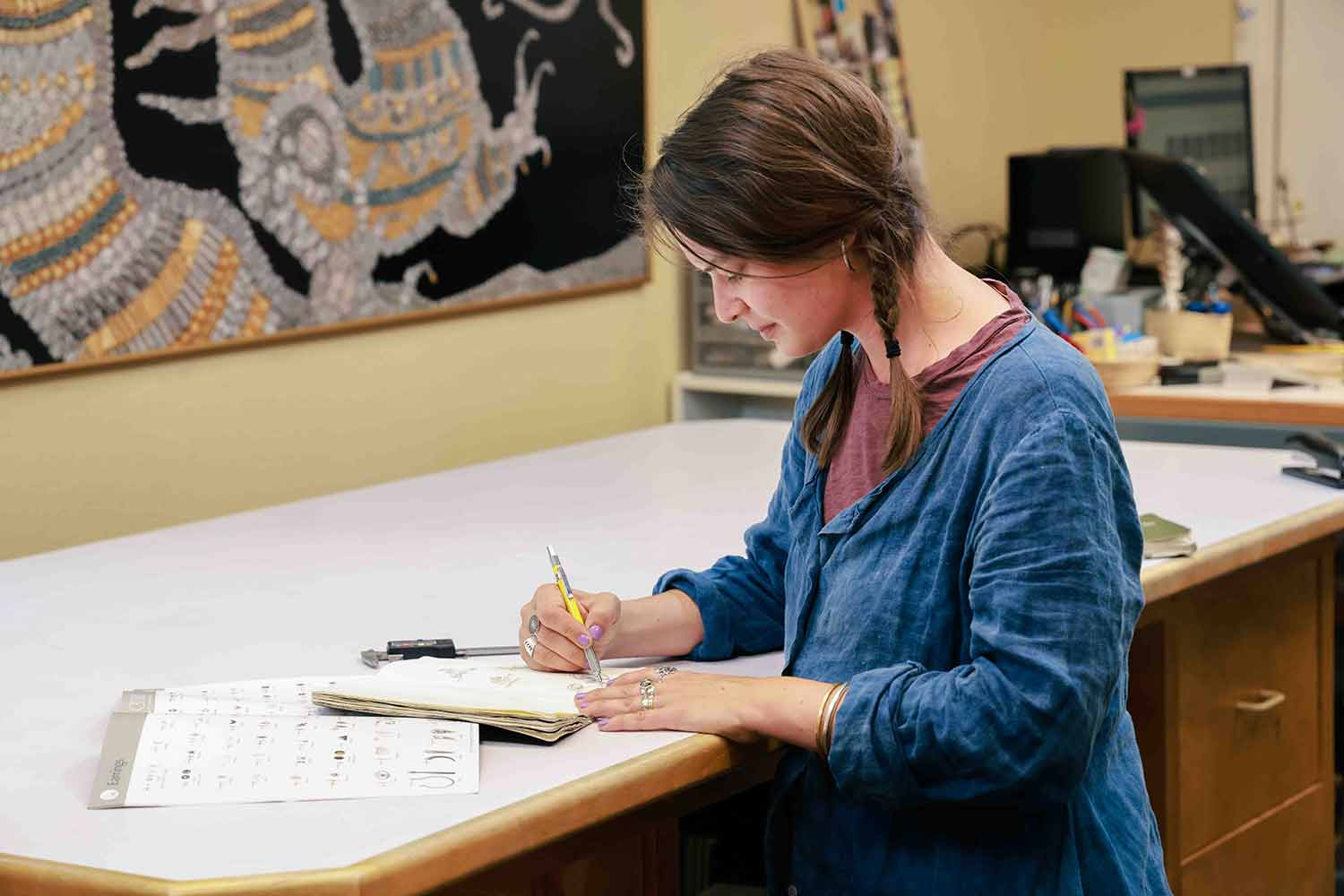 Marcy drawing in sketch book