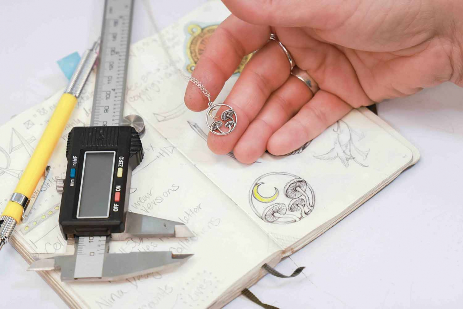 Mushroom necklaces shown with original sketch