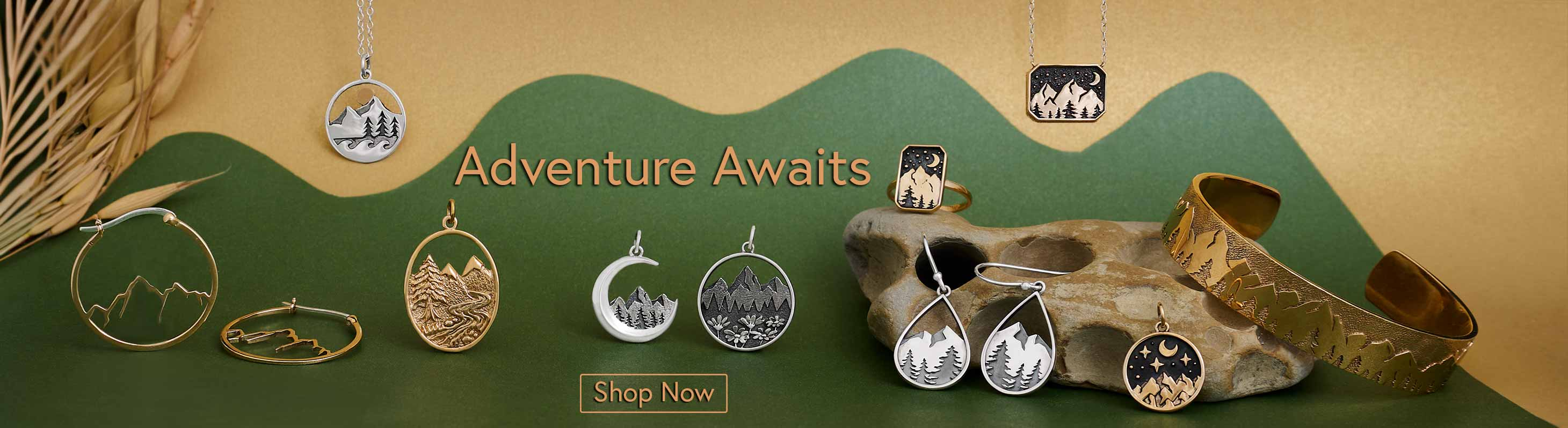 Silver and Bronze Mountain Charms on Green and gold background