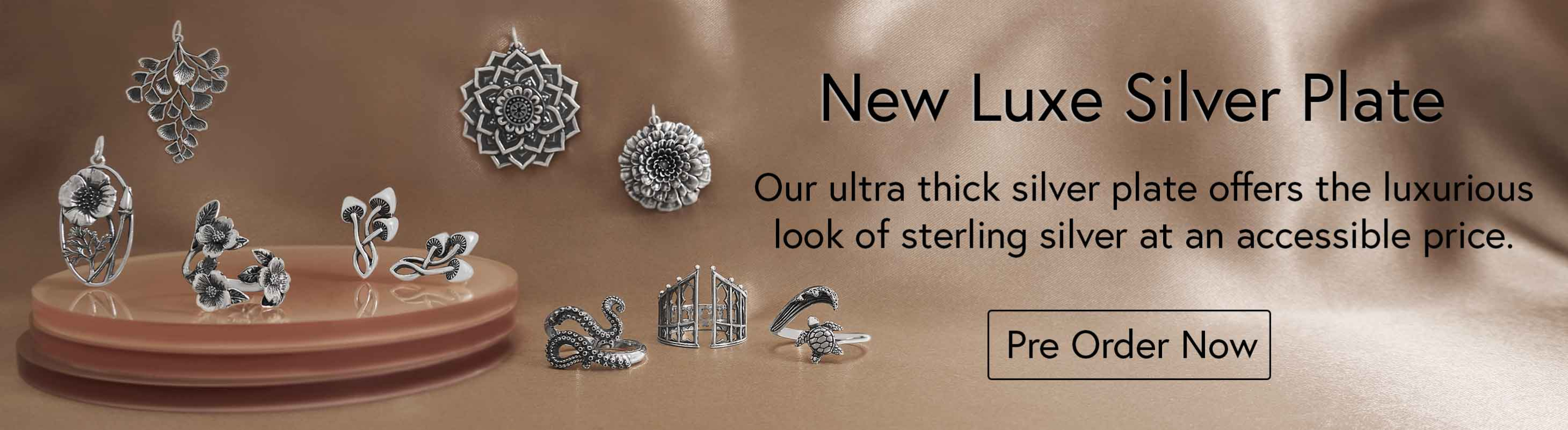 New Luxe Silver Plate. Silver Plate Charms on gold background