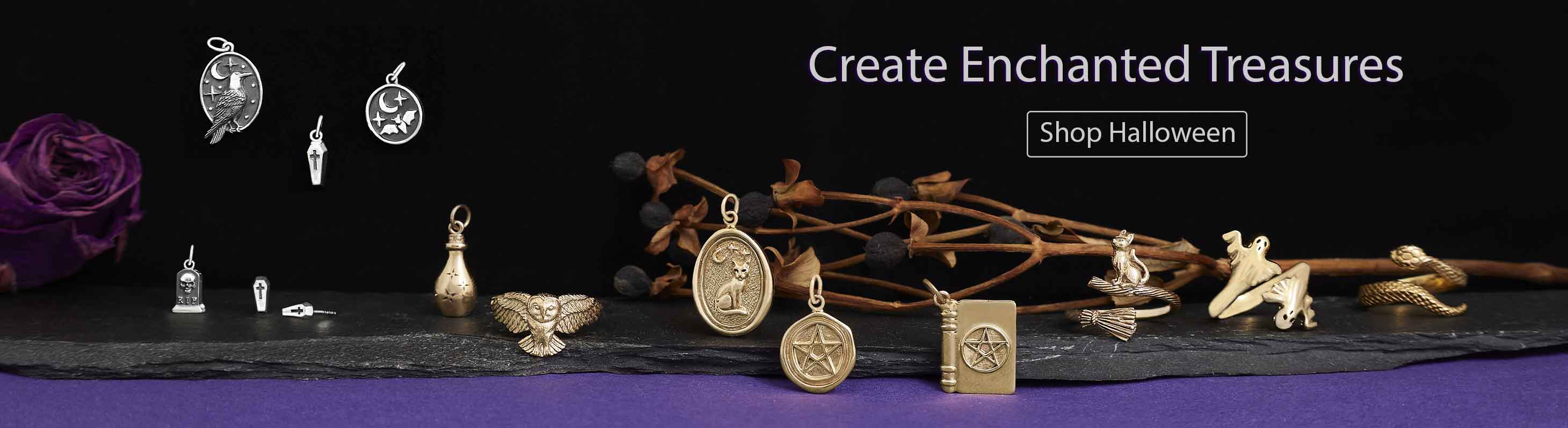 Halloween charms and jewelry on black and purple background