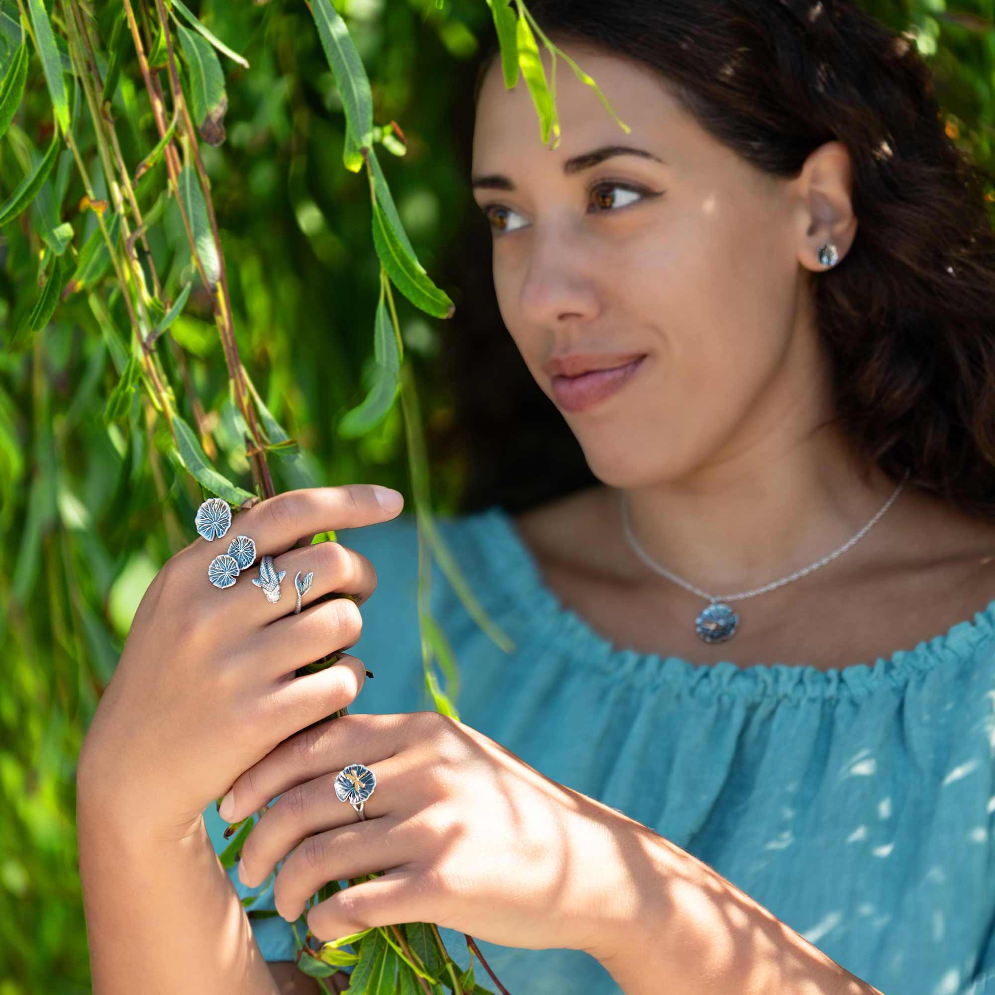 Woman in willow tree wearing silver jewelry