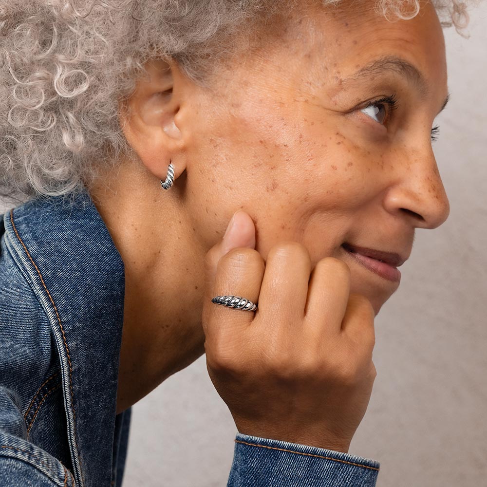 Women wear silver earring and ring