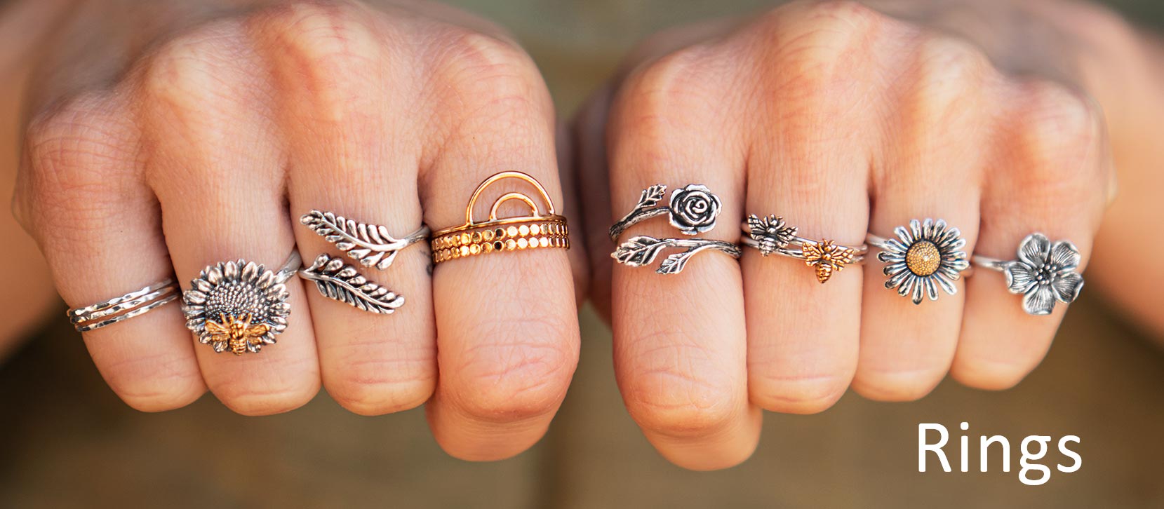 Hands with lots of sterling silver rings