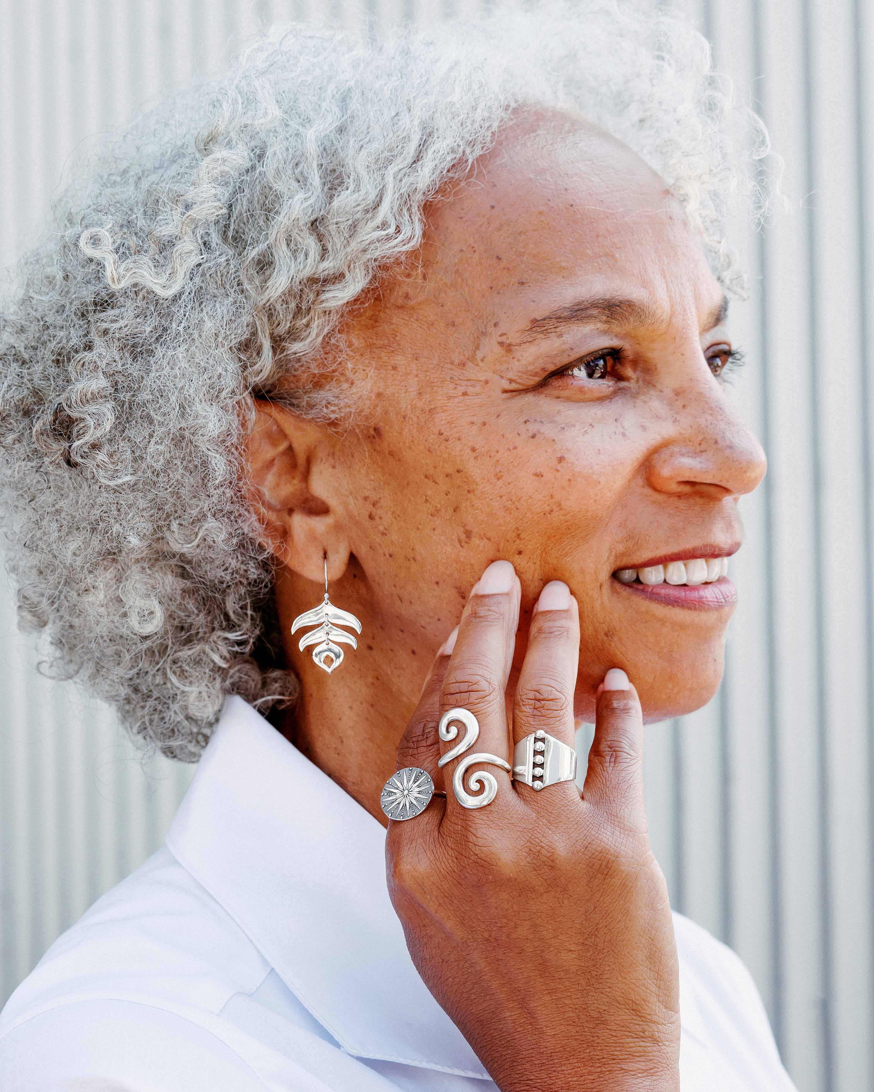 Woman with Silver Hair Wearing jewelry
