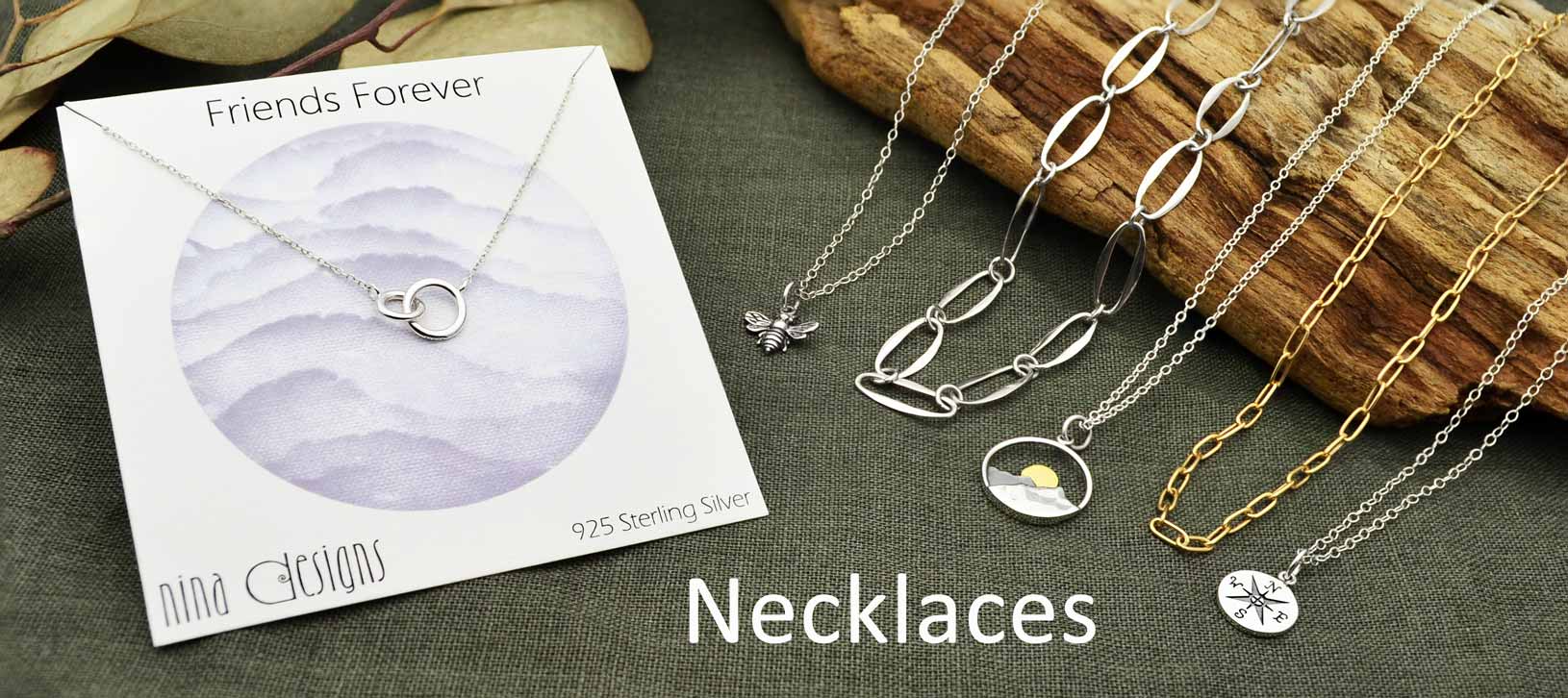 Sterling silver necklace on green background