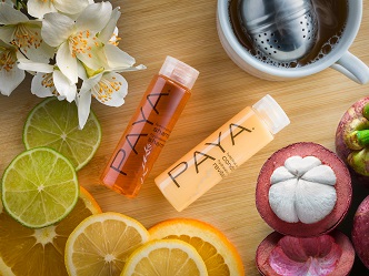 PAYA colorful amenity bottles on a guest room vanity