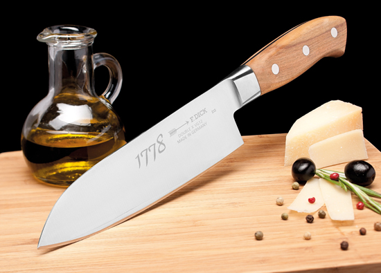 F.Dick 1778 series chef knife on wood cutting board