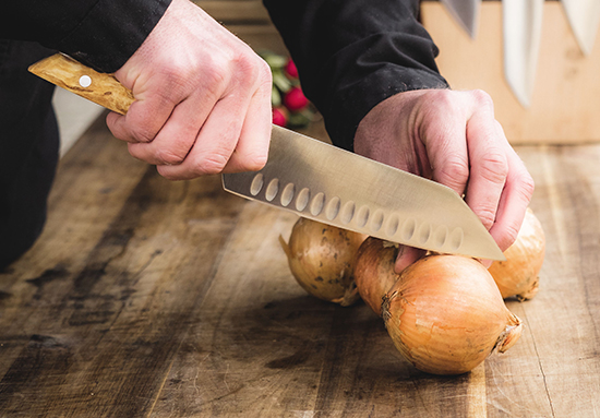 FDick VIVUM Santoku knife chopping an onion