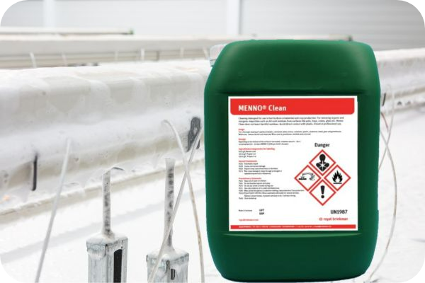 menno clean jug in front of a foam covered greenhouse 